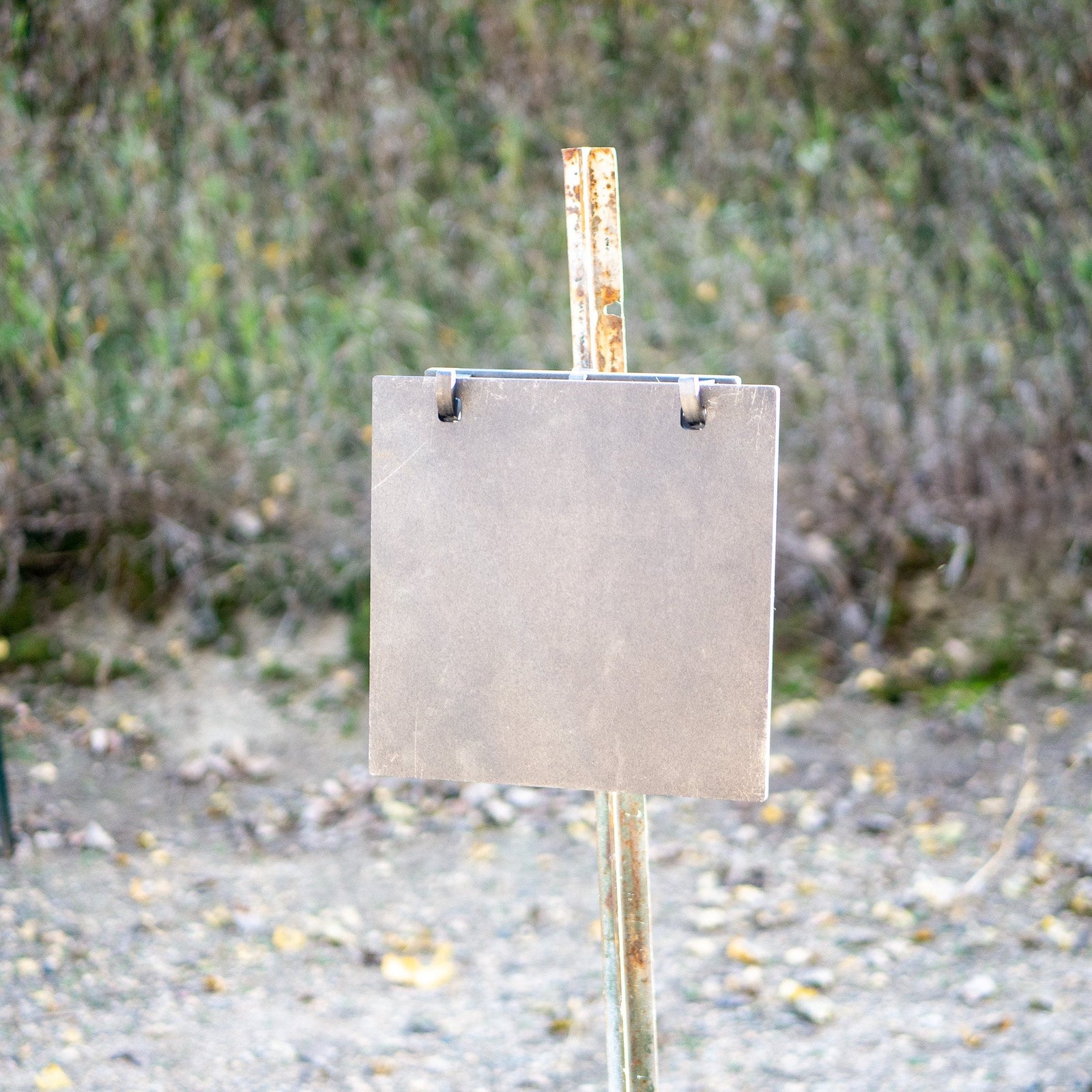 Double hole square gong on a double hook t-post mount front view