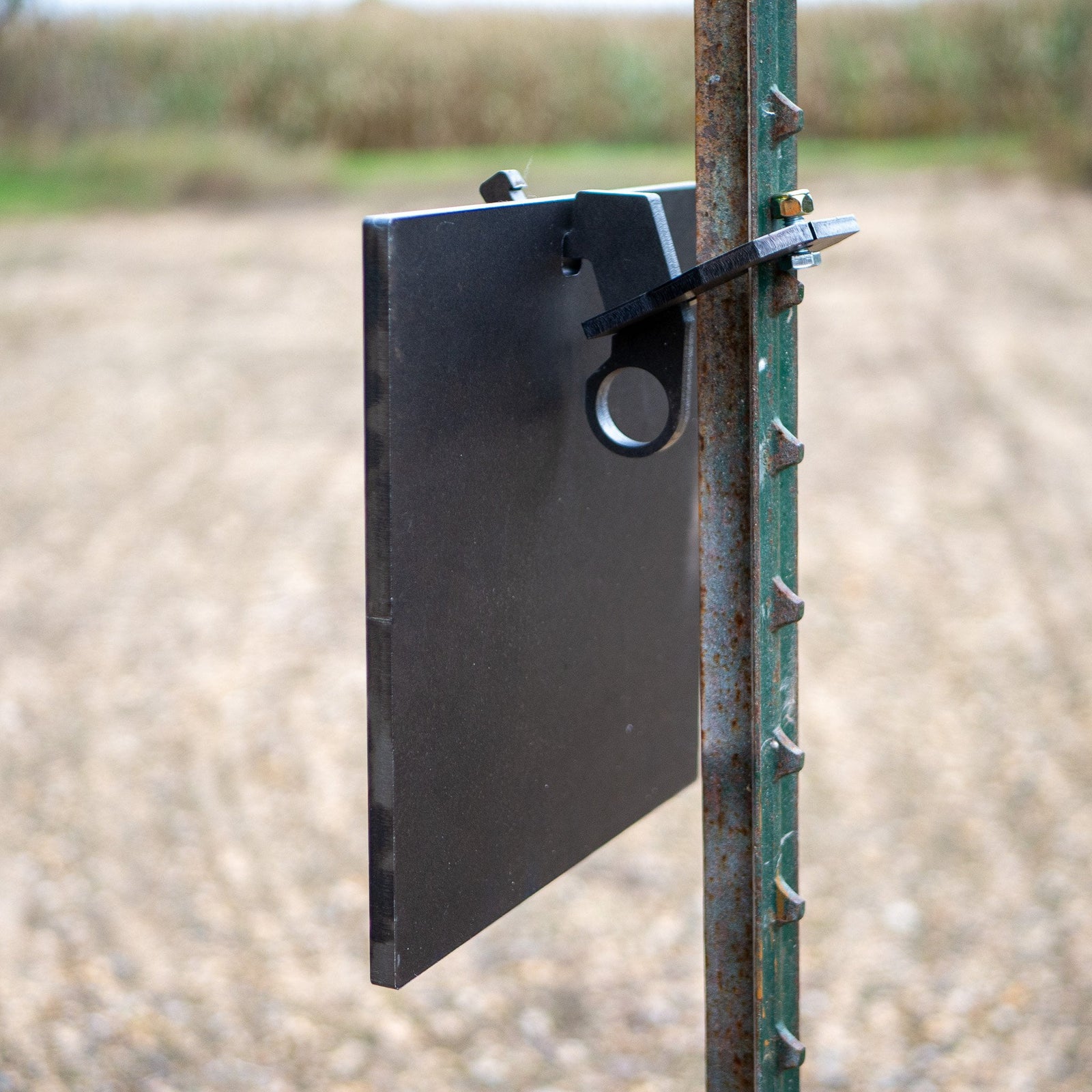 single hole square gong hanging on a single hook t-post mount rear view