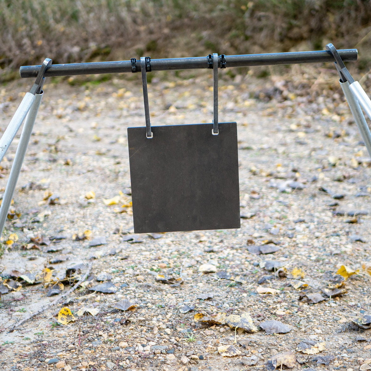 Double hole square gong on a pipe hanger gong hanging kit close up