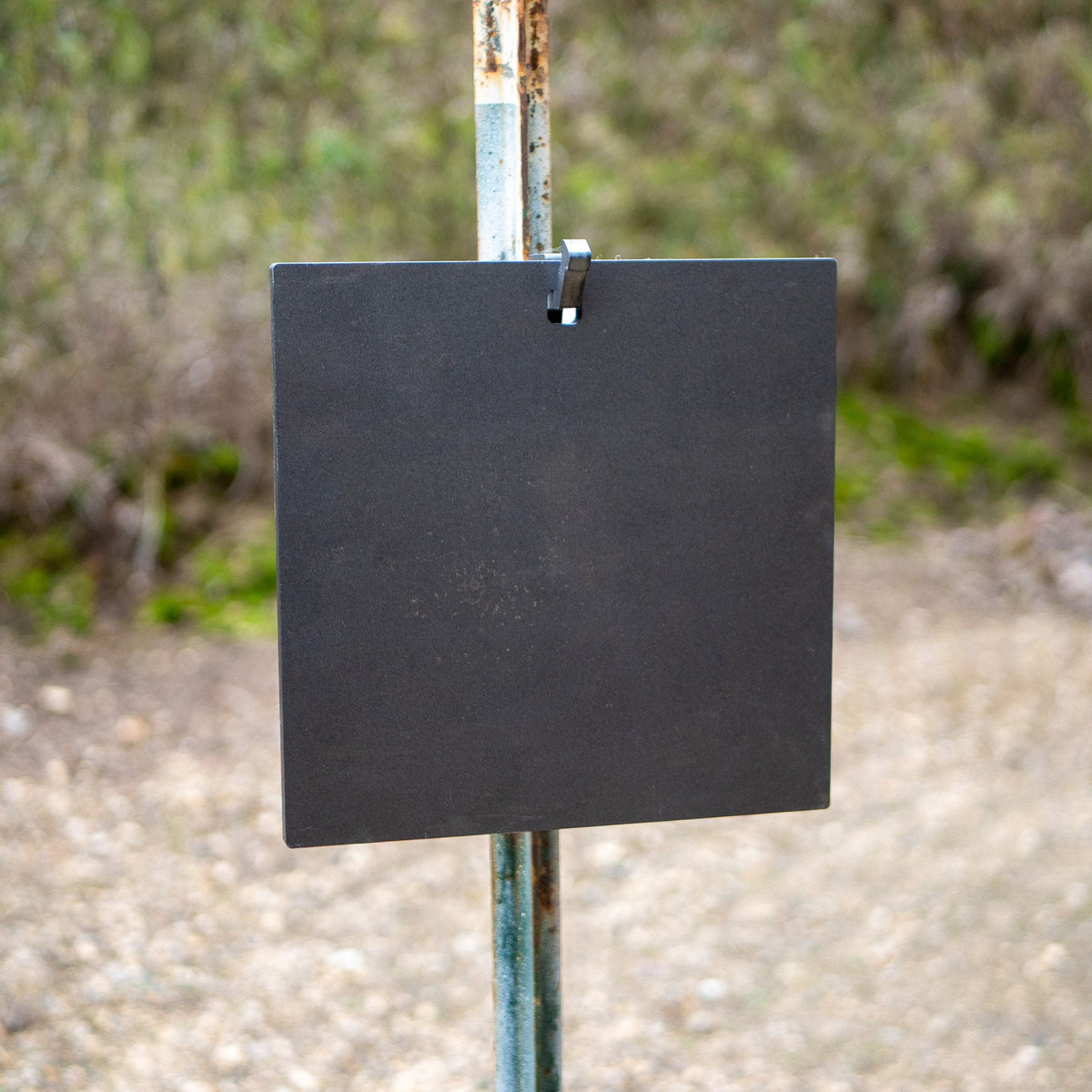 single hole square gong hanging on a single hook t-post mount front view