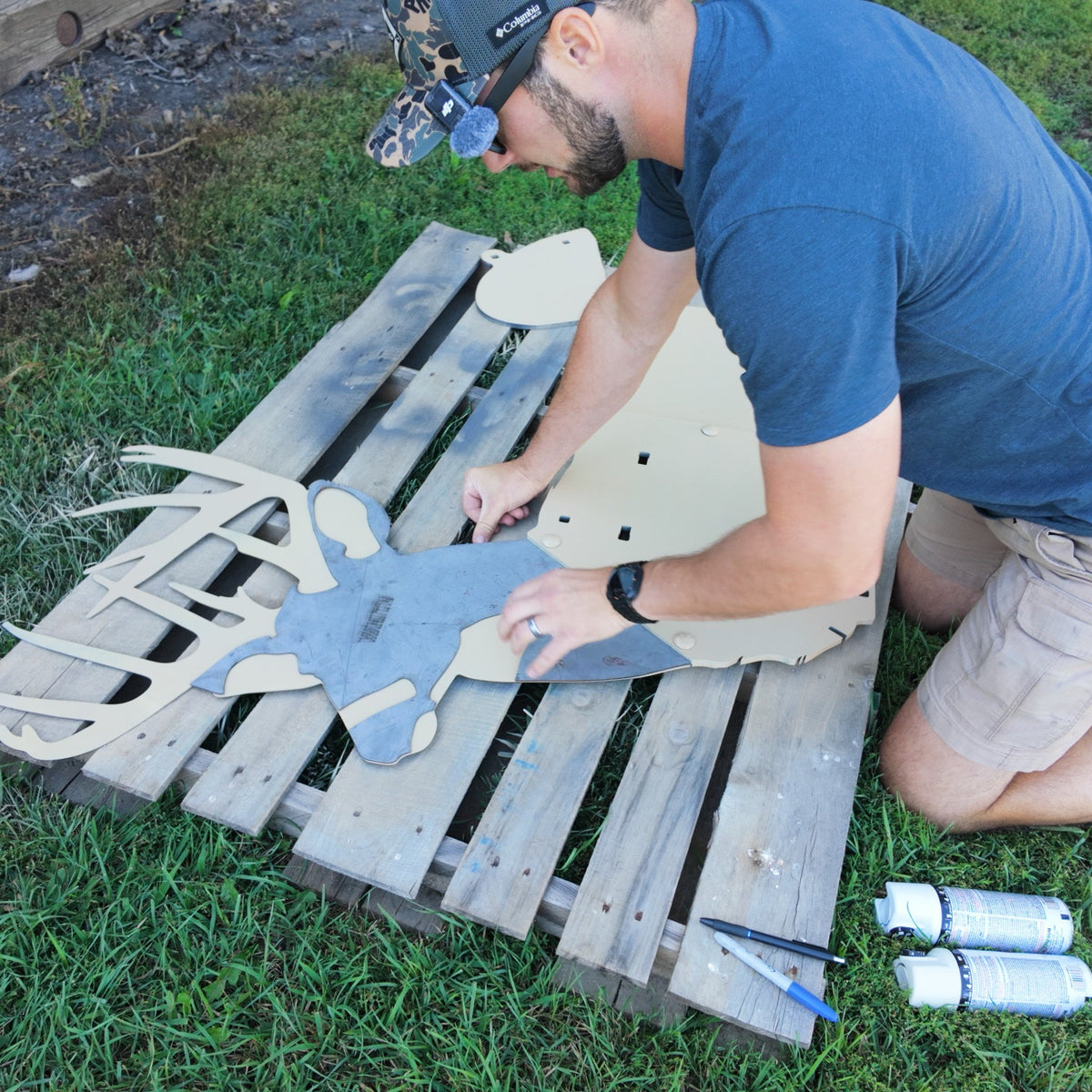 Full-size whitetail buck steel target getting set up with stencil to paint realistically.
