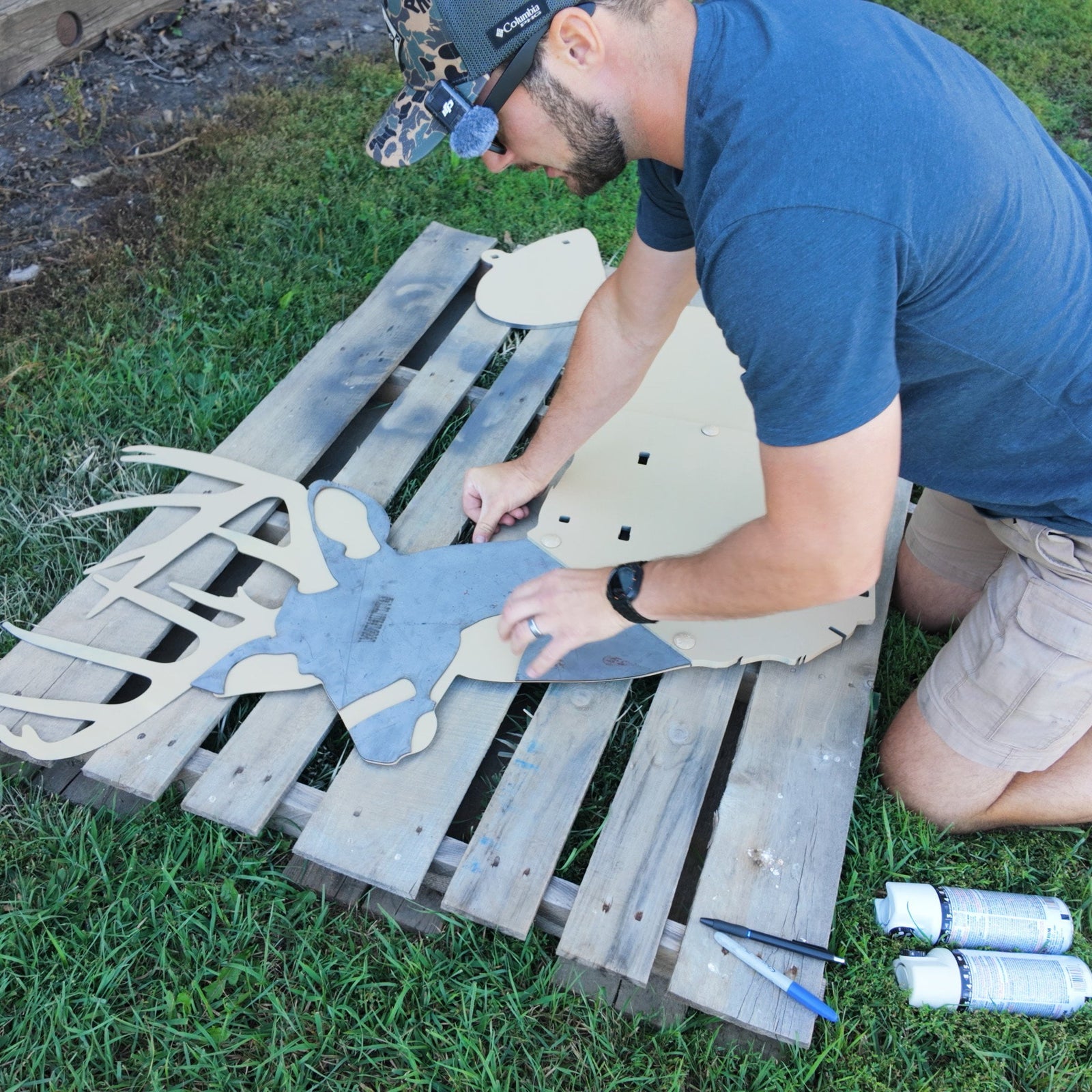 Full-size whitetail buck steel target getting set up with stencil to paint realistically.