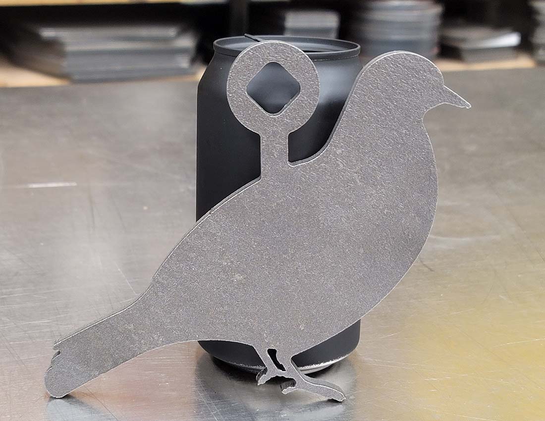 ar500 steel pigeon target in front of pop can for scale