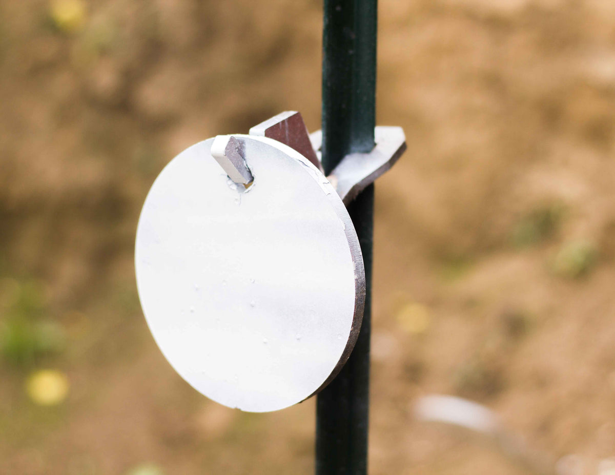 6 inch single hole round gong hanging on a single hook t-post mount