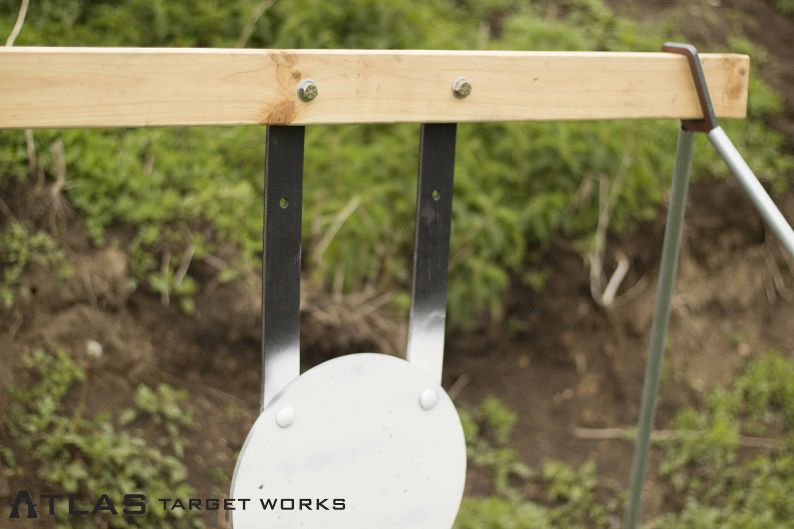 rubber steel target gong hanging straps bolted to wood 2x4